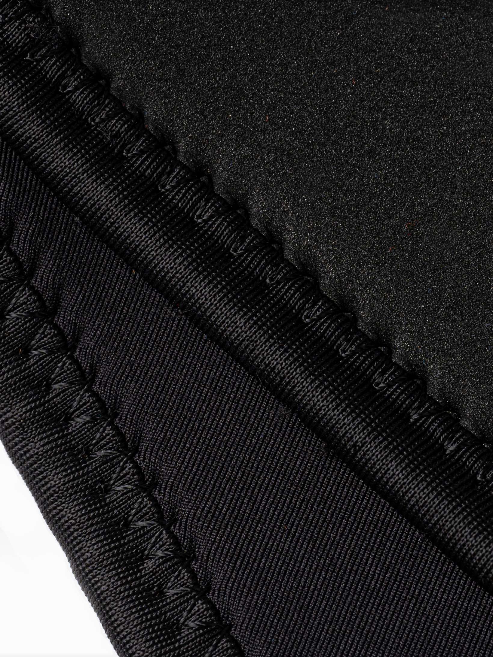 Close up of the stitching on the lines exterior of the womens open cell wetsuit