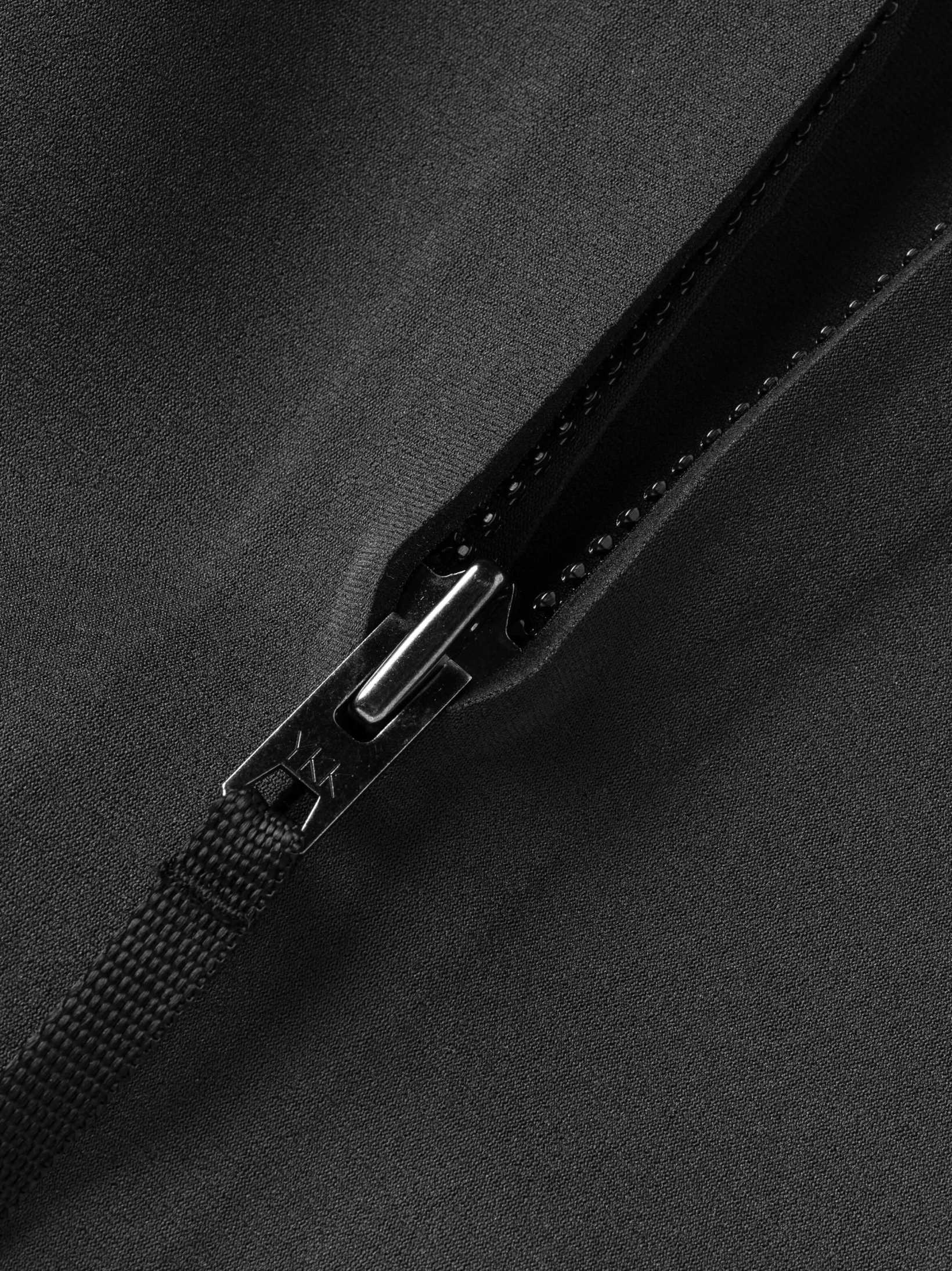 Close up of the quality zipper on this womens wetsuit